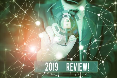 Writing note showing 2019 Review. Business concept for remembering past year events main actions or good shows Picture photo network scheme with modern smart deviceの写真素材