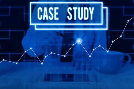 Writing note showing Case Study. Business concept for analysis and a specific research design for examining a problem Woman wear formal work suit present using smart latest deviceの写真素材