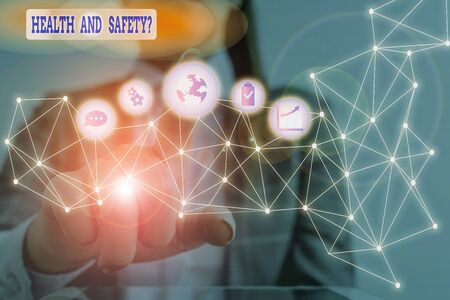 Conceptual hand writing showing Health And Safety Question. Concept meaning regulations and procedures to prevent accident or injury Picture photo network scheme with modern smart deviceの写真素材