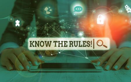 Conceptual hand writing showing Know The Rules. Concept meaning set explicit or regulation principles governing conduct Picture photo network scheme with modern smart deviceの写真素材