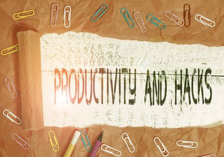 Handwriting text writing Productivity Hacks. Conceptual photo tricks that you get more done in the same amount of time Stationary and torn cardboard placed above a wooden classic table backdropの写真素材