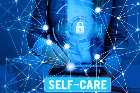 Writing note showing Self Care. Business concept for practice of taking action to preserve or improve ones own health Picture photo system network scheme modern smart deviceの写真素材