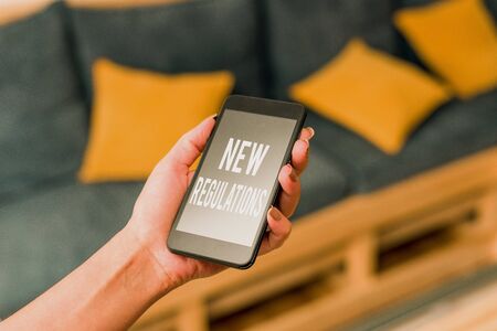Writing note showing New Regulations question. Business concept for rules made government order to...