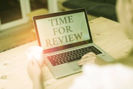Handwriting text writing Time For Review. Conceptual photo review of a system or situation in its formal examination woman laptop computer smartphone mug office supplies technological devicesの写真素材