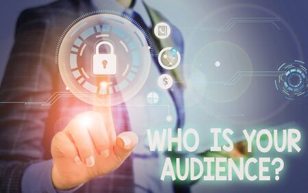 Handwriting text Who Is Your Audience Question. Conceptual photo who is watching or listening to it Woman wear formal work suit present presentation using smart latest deviceの写真素材