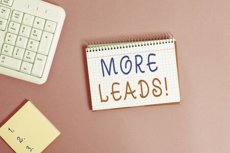 Text sign showing More Leads. Business photo showcasing initiation of consumer interest or enquiry into product Writing equipments and computer stuffs placed above classic wooden tableの写真素材