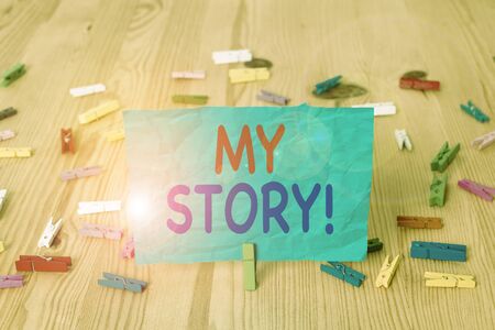 Word writing text My Story. Business photo showcasing your past life events actions or choices you made Colored clothespin papers empty reminder wooden floor background officeの写真素材