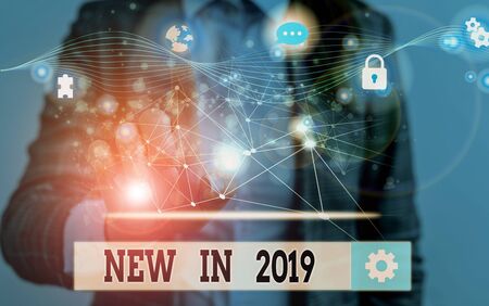 Word writing text New In 2019. Business photo showcasing what will be expecting or new creation for the year 2019 Picture photo system network scheme modern technology smart deviceの写真素材