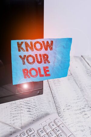 Handwriting text Know Your Role. Conceptual photo end acting outside who you actually are Play your position Notation paper taped to black computer monitor screen near white keyboardの写真素材