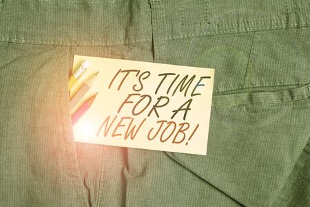 Writing note showing It S Time For A New Job. Business concept for having paid position regular employment Writing equipment and yellow note paper inside pocket of man trousersの写真素材