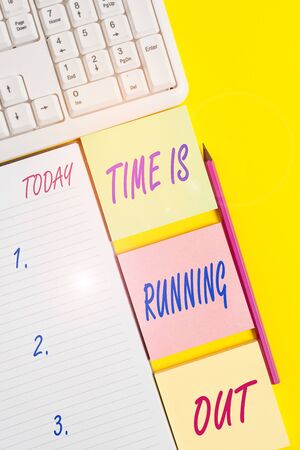 Text sign showing Time Is Running Out. Business photo text Deadline is approaching Urgency things cannot wait Empty papers with copy space on the yellow background tableの写真素材