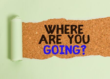 Writing note showing Where Are You Goingquestion. Business concept for used to ask someone the destination headed to Cardboard which is torn placed above a wooden classic tableの写真素材