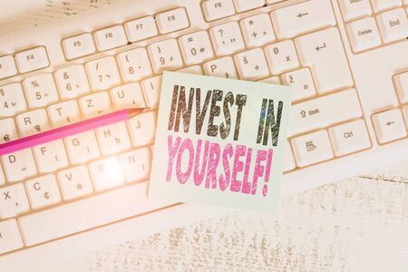Writing note showing Invest In Yourself. Business concept for nvesting in a coach or a training to learn new things Keyboard office supplies rectangle shape paper reminder woodの写真素材