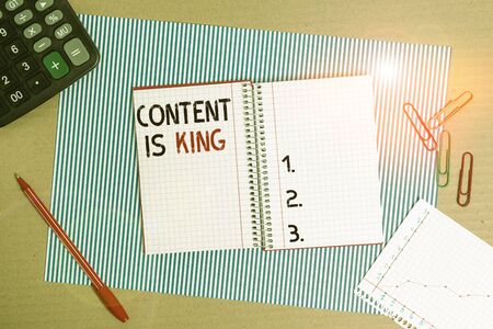 Text sign showing Content Is King. Business photo text believe that content is central to the success of a website Striped paperboard notebook cardboard office study supplies chart paperの写真素材