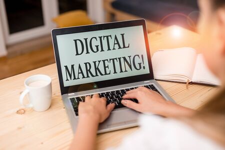 Word writing text Digital Marketing. Business photo showcasing market products or services using technologies on Internet woman laptop computer smartphone mug office supplies technological devicesの写真素材