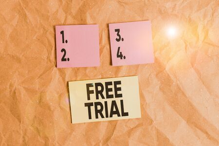 Word writing text Free Trial. Business photo showcasing Product or service offered for no cost to try and give feedback Papercraft craft paper desk square spiral notebook office study suppliesの写真素材