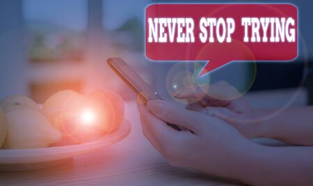 Writing note showing Never Stop Trying. Business concept for Do not give up Continue to Try Again Keep on Doingの写真素材