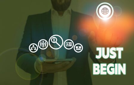 Writing note showing Just Begin. Business concept for to start to happen Begin to do something in business or a jobの写真素材