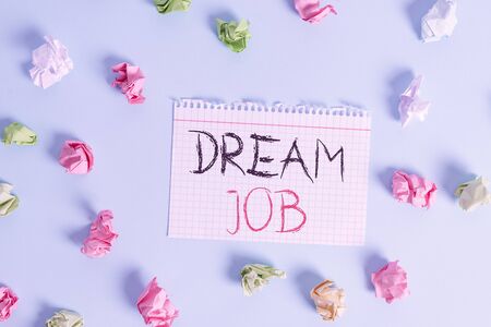 Word writing text Dream Job. Business photo showcasing An act that is paid of by salary and giving you hapiness Colored crumpled rectangle shaped reminder paper light blue backgroundの写真素材