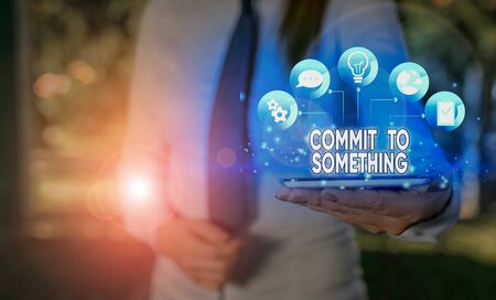 Writing note showing Commit To Something. Business concept for To Live a Life of Purpose with Pride...