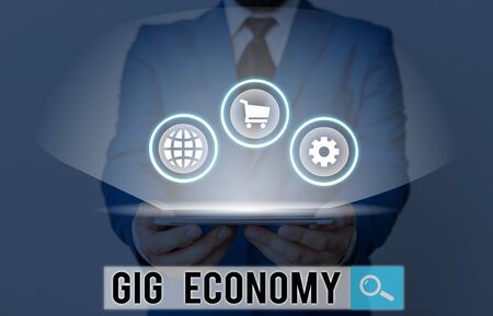 Writing note showing Gig Economy. Business concept for free market system in which temporary positions are commonの写真素材