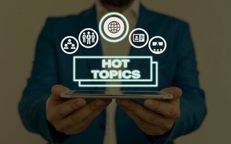 Writing note showing Hot Topics. Business concept for subject that a lot of showing are arguing and discussingの写真素材