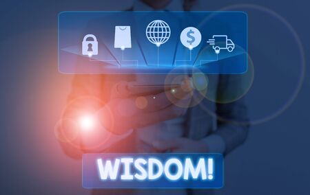 Conceptual hand writing showing Wisdom. Concept meaning the ability to use your knowledge and experience to make decisionsの写真素材