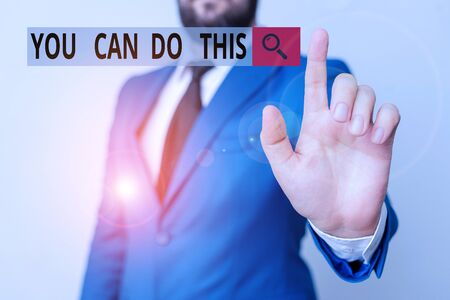 Text sign showing You Can Do This. Business photo text Eagerness and willingness to overcome challenges in life Businessman with pointing finger in front of himの写真素材