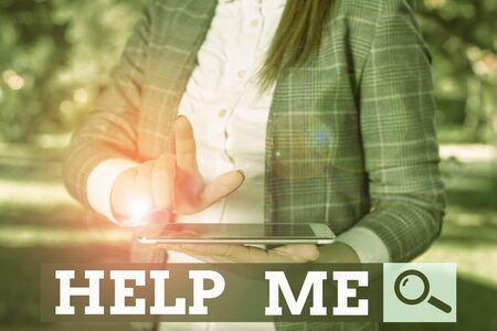 Word writing text Help Me. Business photo showcasing Asking someone to assist you Shouting for it Teamwork Volunteer Outdoor scene with business woman holds lap top with touch screenの写真素材