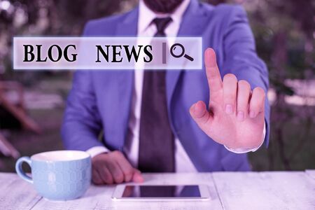 Conceptual hand writing showing Blog News. Concept meaning regularly updated website typically one run by an individual Businessman with pointing finger in front of himの写真素材