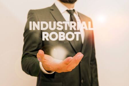 Conceptual hand writing showing Industrial Robot. Concept meaning robotic mechanism used in the fabrication of products Male human with beard wear formal working suit clothes handの写真素材