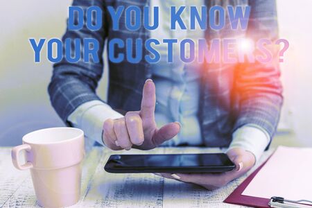 Conceptual hand writing showing Do You Know Your Customers question. Concept meaning asking to identify a customer s is nature Business woman sitting with mobile phone and cup of coffeeの写真素材