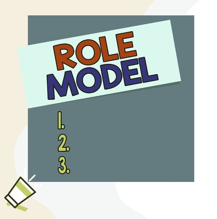 Word writing text Role Model. Business photo showcasing a demonstrating looked to by others as an example to be imitated Speaking trumpet on left bottom and paper attached to rectangle backgroundの写真素材