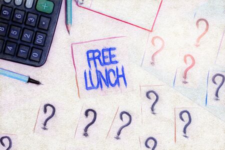 Handwriting text Free Lunch. Conceptual photo something you get free that you usually have to work or pay for Mathematics stuff and writing equipment above pastel colours backgroundの写真素材