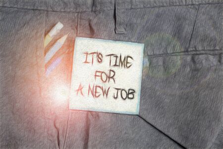 Text sign showing It S Time For A New Job. Business photo showcasing Career changes seeking other work Recruitment Writing equipment and green note paper inside pocket of man work trousersの写真素材
