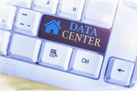 Word writing text Data Center. Business photo showcasing a repository that houses computing facilities like servers White pc keyboard with empty note paper above white background key copy spaceの写真素材