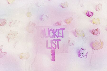 Writing note showing Bucket List. Business concept for a list of the things that a demonstrating would like to do or achieve Colored crumpled paper empty reminder white floor clothespinの写真素材