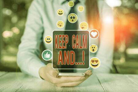 Conceptual hand writing showing Keep Calm And. Concept meaning motivational poster produced by British governmentの写真素材