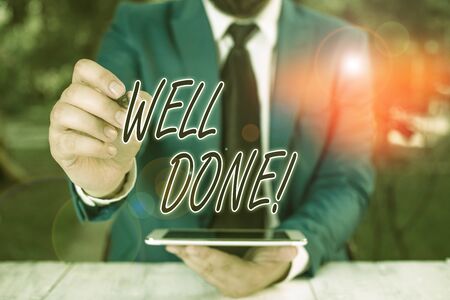 Word writing text Well Done. Business photo showcasing used praising demonstrating or group for something have done good way Businessman pointing with pen in empty copy spaceの写真素材