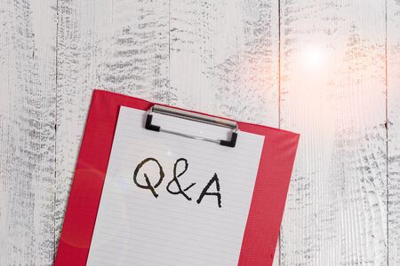 Word writing text Q And A. Business photo showcasing defined as questions being asked and answers Colored clipboard blank paper sheet old retro wooden vintage backgroundの写真素材
