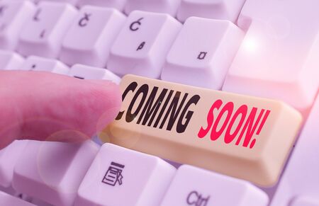 Writing note showing Coming Soon. Business concept for event or action that will happen after really...