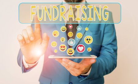 Conceptual hand writing showing Fundraising. Concept meaning seeking to generate financial support for charity or causeの写真素材