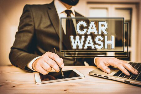 Writing note showing Car Wash. Business concept for a building containing equipment for washing cars or other vehicles Male human wear formal clothes present use hitech smartphoneの写真素材