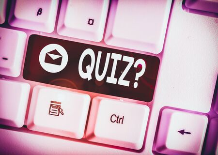 Text sign showing Quiz Question. Business photo showcasing test of knowledge as competition between individuals or teams White pc keyboard with empty note paper above white background key copy spaceの写真素材