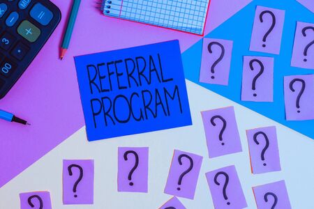 Conceptual hand writing showing Referral Program. Concept meaning employees are rewarded for introducing suitable recruits Mathematics stuff and writing equipment on pastel backgroundの写真素材