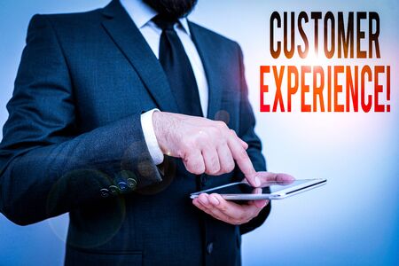 Word writing text Customer Experience. Business photo showcasing product of interaction between organization and buyer Male human wear formal clothes present presentation use hi tech smartphoneの写真素材