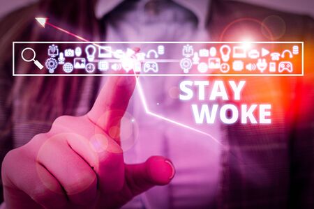 Handwriting text writing Stay Woke. Conceptual photo being aware of your surroundings and things going on Keep informedの写真素材