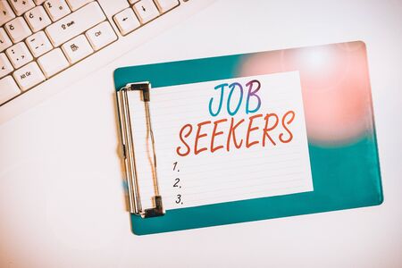 Word writing text Job Seekers. Business photo showcasing an unemployed demonstrating who is actively looking for employment Flat lay above table with pc keyboard and copy space note paperの写真素材