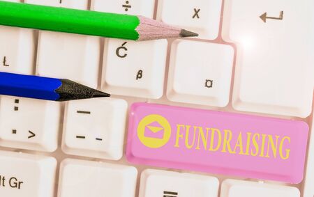 Handwriting text Fundraising. Conceptual photo act of collecting or producing money for a particular purposeの写真素材