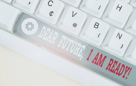 Conceptual hand writing showing Dear Future I Am Ready. Concept meaning Confident to move ahead or to face the future White pc keyboard with note paper above the white backgroundの写真素材